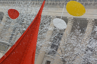 Red, yellow, and white sculpture against a wintery background